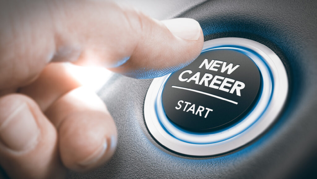 A finger pressing a button that says, “New Career – Start”, insinuating he is starting a new job.