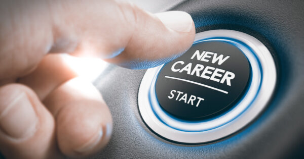 A finger pressing a button that says, “New Career – Start”, insinuating he is starting a new job.