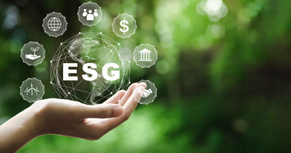 ESG investments represented by ESG icons floating around a digital earth.
