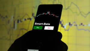 Smart-Beta and a stock chart on a cell phone screen.