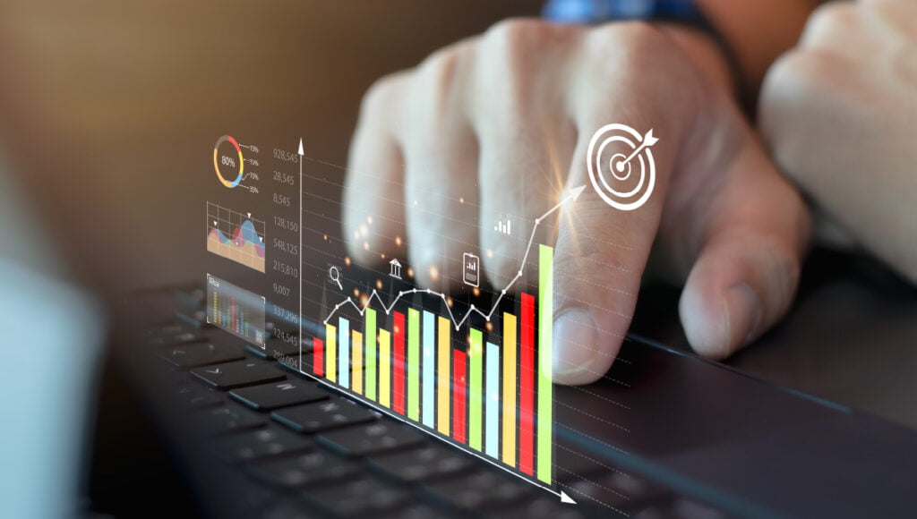 Stock charts projected on a transparent screen