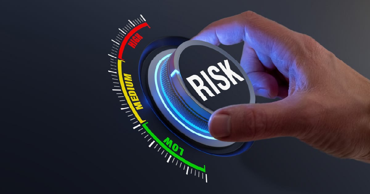 A person turning a knob labeled “risk”