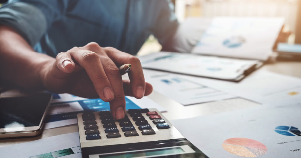 An investor calculating their ideal emergency fund balance.